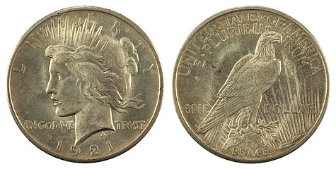 Obverse and Reverse of a circulated 1921 Peace Dollar Silver Coin